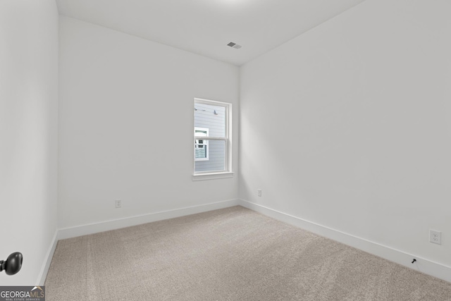 empty room with carpet flooring