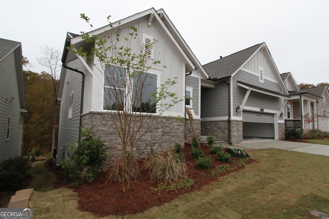 view of front of property featuring a garage and a front lawn