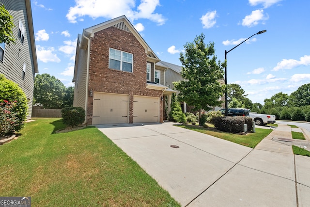 view of front of home featuring a garage and a front yard