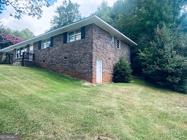 view of property exterior with a lawn