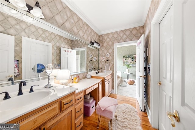 bathroom featuring vanity, crown molding, and hardwood / wood-style floors