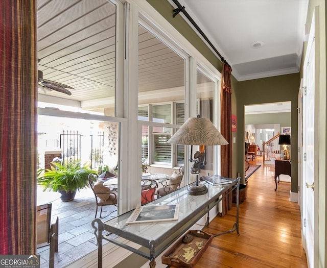 interior space featuring light hardwood / wood-style flooring and ornamental molding