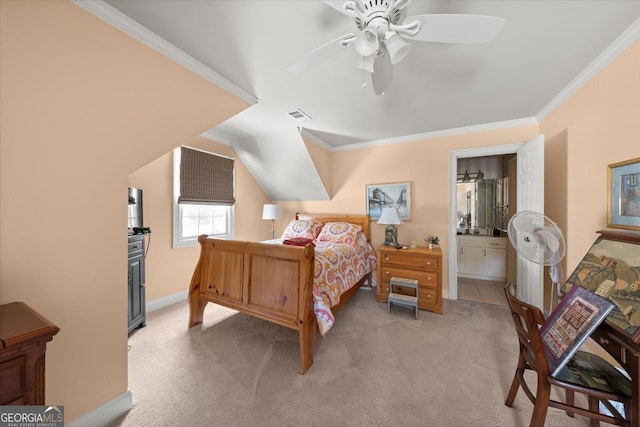 carpeted bedroom featuring ceiling fan, ensuite bath, and ornamental molding