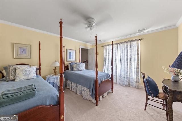 carpeted bedroom featuring ceiling fan and crown molding