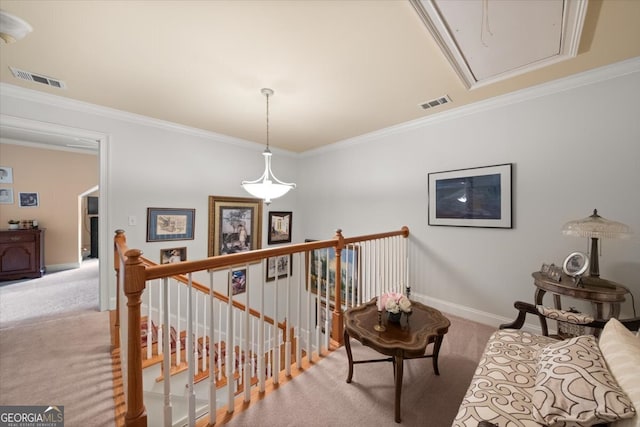 hallway featuring ornamental molding and light colored carpet