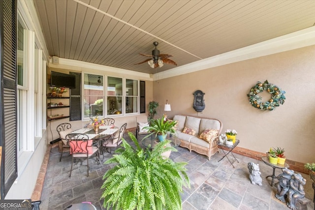 view of patio / terrace featuring ceiling fan