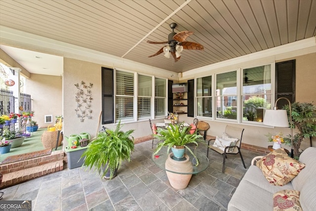 view of patio / terrace featuring ceiling fan