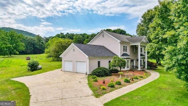 view of property exterior with a garage and a yard