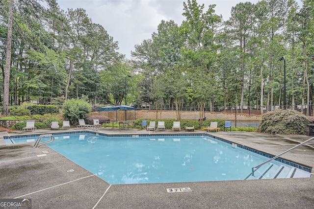 view of swimming pool featuring a patio