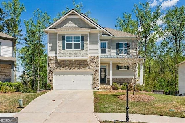 craftsman-style home featuring a garage and a front yard