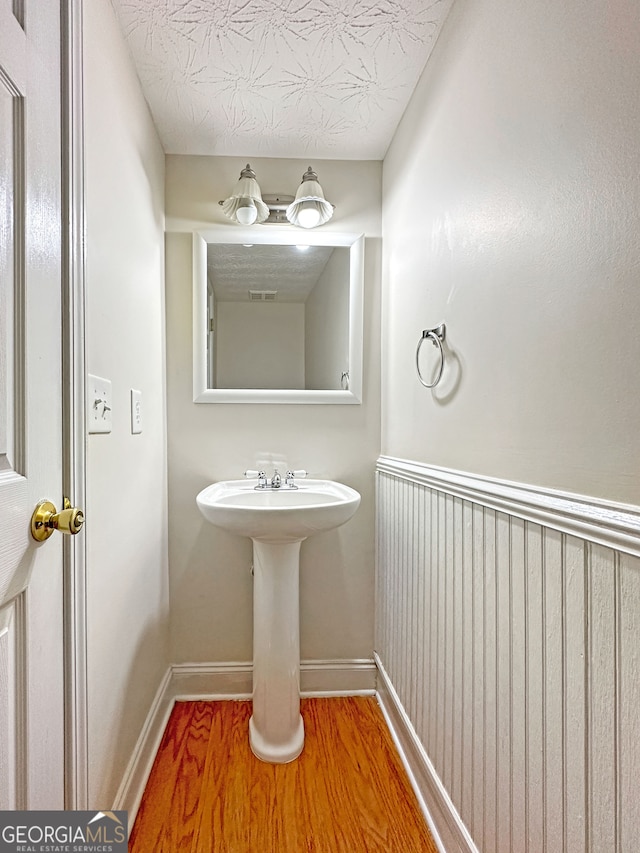 bathroom featuring hardwood / wood-style flooring