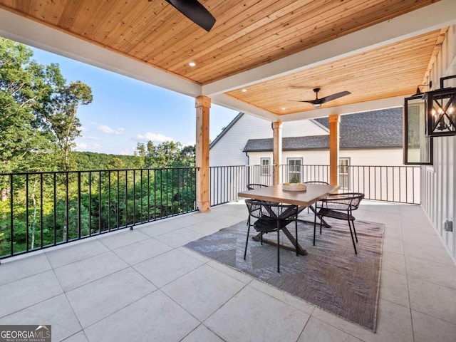 view of patio with a balcony and ceiling fan