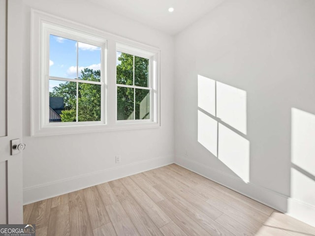 unfurnished room featuring light wood-type flooring