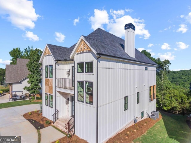 view of property exterior with central AC