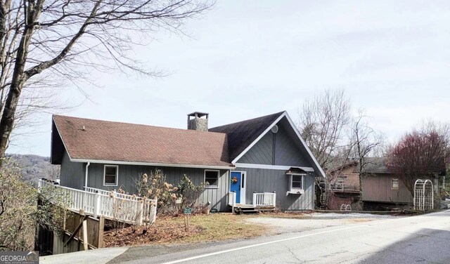 back of house featuring a balcony