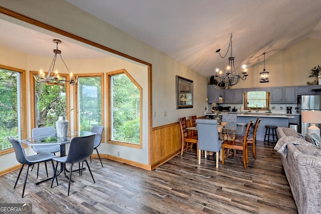 dining room with hardwood / wood-style floors, a chandelier, and a wealth of natural light