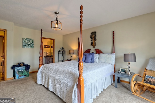 carpeted bedroom featuring connected bathroom