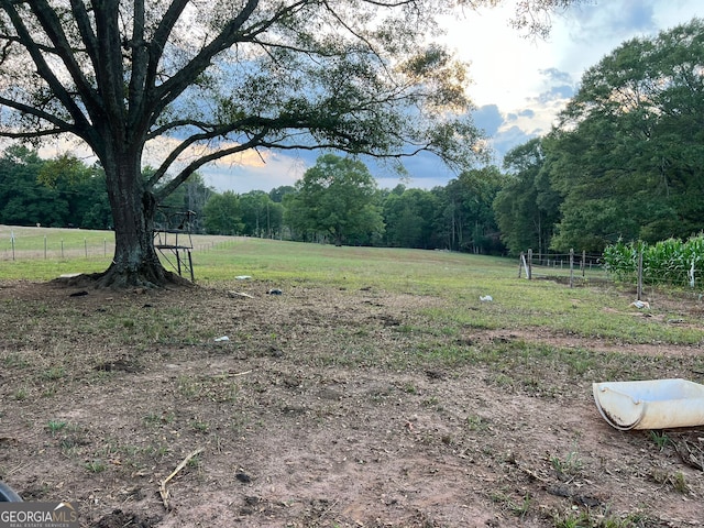 view of yard with a rural view