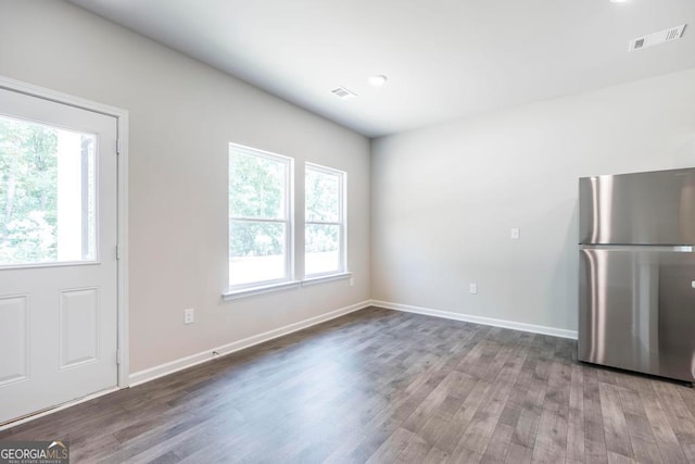 unfurnished dining area with hardwood / wood-style flooring