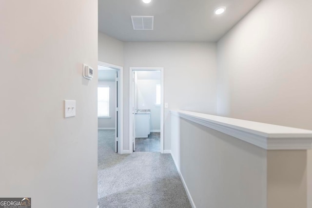 hallway featuring carpet flooring