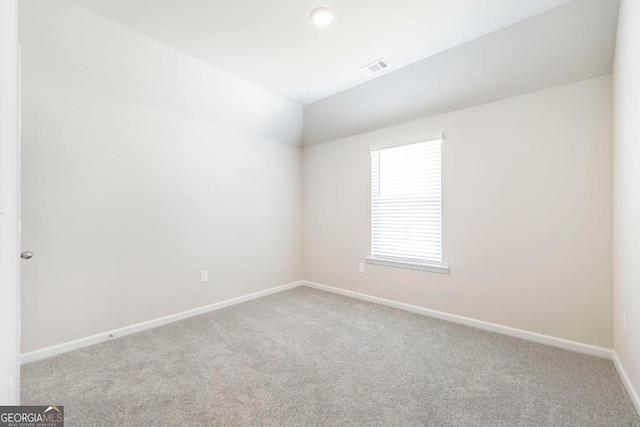 spare room featuring carpet floors