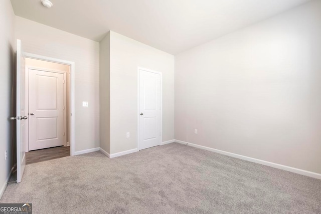 unfurnished bedroom with carpet