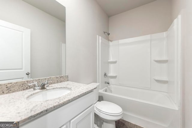 full bathroom with vanity, toilet, and washtub / shower combination