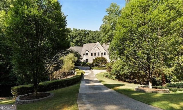 view of home's community featuring a yard