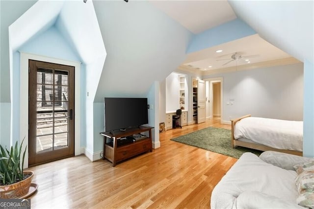 bedroom with hardwood / wood-style floors, ceiling fan, lofted ceiling, and access to outside