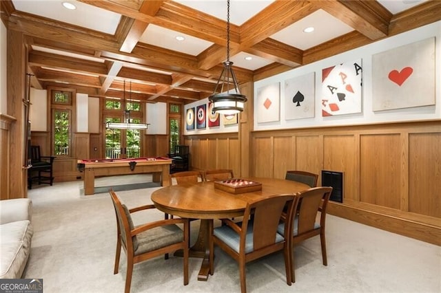 dining space with coffered ceiling, beamed ceiling, light colored carpet, wooden walls, and pool table