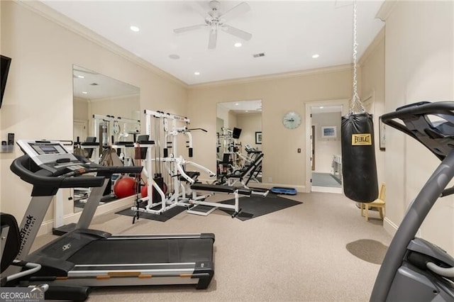 workout area with ceiling fan and ornamental molding