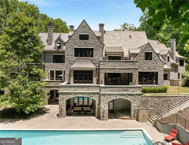 rear view of house featuring a patio