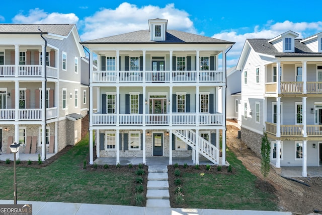 view of front of property featuring covered porch and a balcony