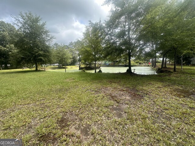 view of yard with a water view