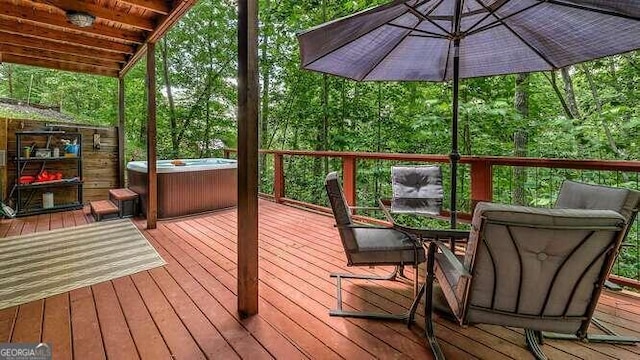 wooden deck with a hot tub