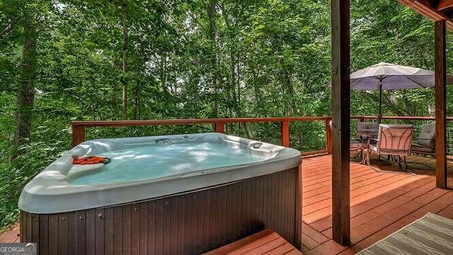 deck featuring a hot tub