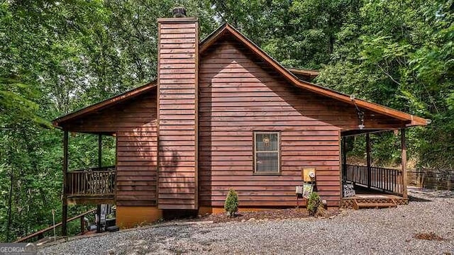 view of property exterior featuring a wooden deck