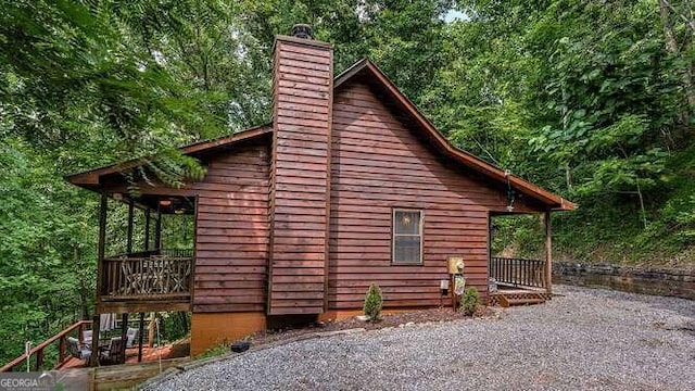 1509 Millenium Dr, Young Harris, GA 30582 - view of side of property with a chimney and a forest view