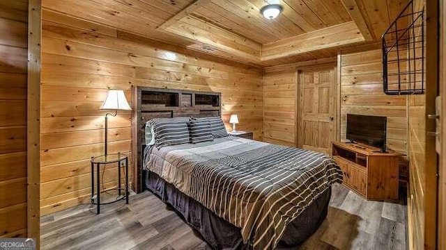 bedroom featuring hardwood / wood-style floors, wood ceiling, and wood walls