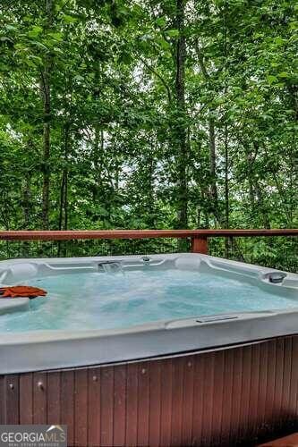 view of pool featuring a hot tub