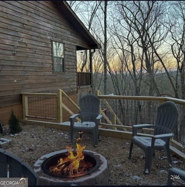 exterior space featuring an outdoor fire pit