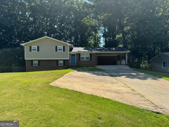 tri-level home featuring a carport and a front lawn