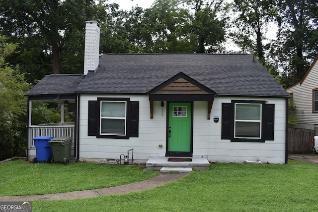 view of front of home with a front yard