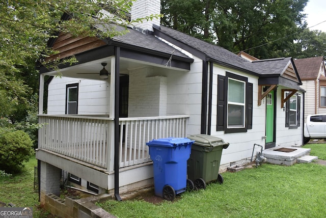 view of side of home with a lawn