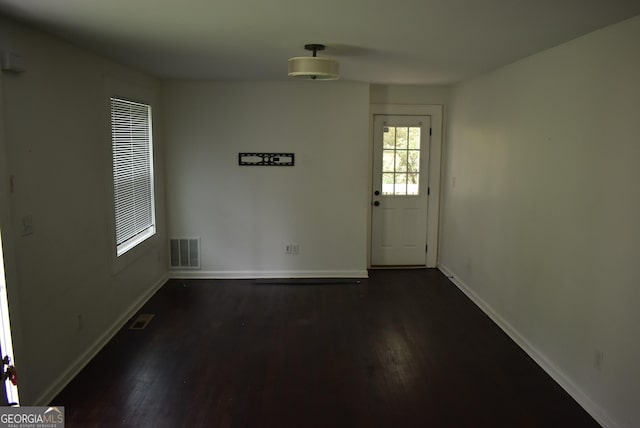 interior space with dark hardwood / wood-style flooring