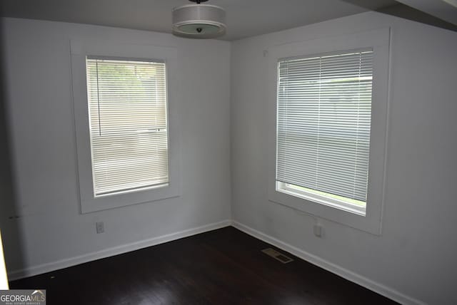 spare room featuring hardwood / wood-style floors