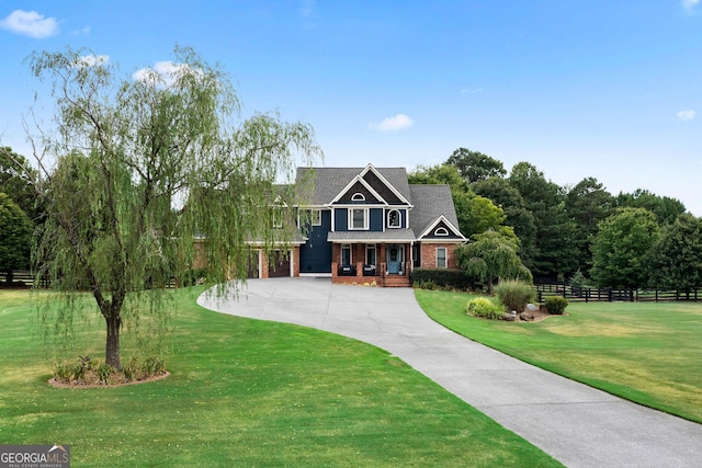 view of front of house featuring a porch and a front lawn