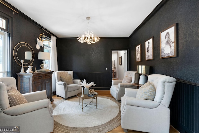 living room with crown molding, a wealth of natural light, and light hardwood / wood-style floors