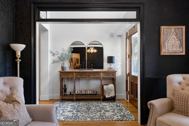 sitting room with wood-type flooring