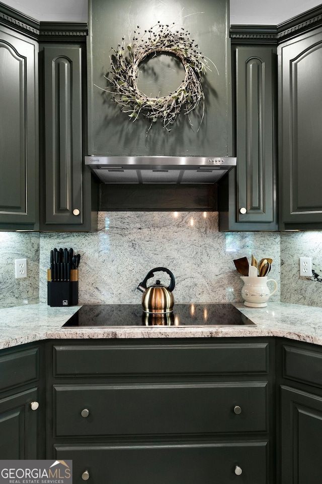 kitchen featuring black electric cooktop and decorative backsplash